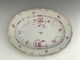 A large KPM meat platter, oval form with ogee rim, pink onion flower type design