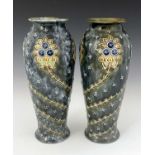 A pair of Doulton Lambeth stoneware vases, shouldered form, relief moulded with Glasgow roses,