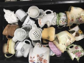 A collection of Continental and English porcelain shaving mugs (2 trays)