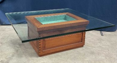 A glass top coffee table. W: 102 cm H: 36 cm (the glass is 2 cm thick)
