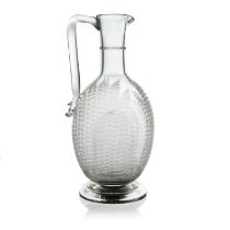 A Victorian glass Champagne jug, circa 1870, footed form etched with fern design, angled handle,