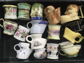 A collection of 19th and 20th century continental and English ceramic shaving mugs (2 trays)