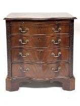 A mahogany serpentine chest of drawers of Georgian design, moulded top, brushing slide over four