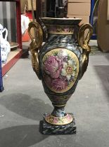 A Limoges twin-handled baluster vase of Empire Revival design, gilt swan twin handles, panels of