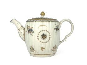 A Caughley barrel form teapot, circa 1785, reeded form, underglaze blue floral and gilt