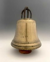 A large antique cast bronze bell, double cast iron loop canons, gently domed ringed shoulder, waist,