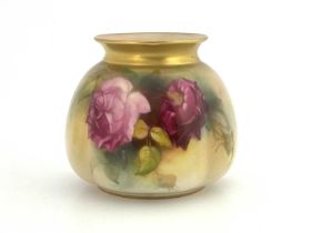A Royal Worcester rose painted vase, 1924, squat lobed form, gilt rim, puce mark, 8cm high