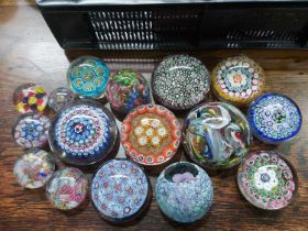 A collection of glass paperweights including Murano millefiori, scrambled etc.
