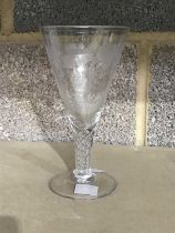 A Stuart wine glass of Georgian design, conical bowl etched with trailing vines, air twist spiral