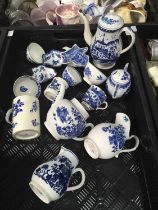 A collection of 18th century English blue and white tea wares, and tableware including a miniature