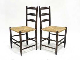 Lawrence Neal after Ernest Gimson, a pair of Cotswold School Clisset ladder back chairs, circa