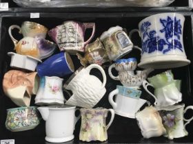 A collection of ceramic shaving mugs including a Coalport silver mounted shaving mug with moulded