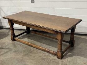 A traditional oak coffee table, baluster-turned legs, 118cm wide, 54cm deep
