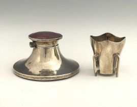 A George V silver capstan inkwell, the hinged cover inset with simulated puce coloured enamel panel,