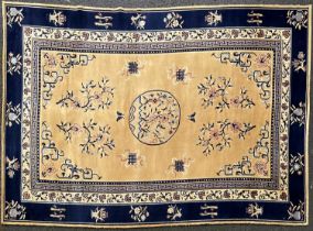 A large Chinese Adoros wool carpet, circa 1970's, blue Greek Key border, gold centre with floral