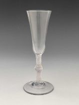 An opaque twist glass flute, circa 1760, the round funnel bowl on a single series multi stranded