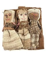 A Peruvian Chancay triple group of textile burial dolls, each as children with expressive faces