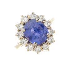 An 18ct gold unheated Sri Lankan colour change sapphire and diamond cluster ring
