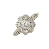 An early 20th century 18ct gold and platinum diamond floral cluster ring