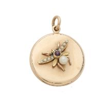 An early 20th century 15ct gold ruby and pearl bee locket pendant