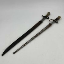 A French M1874 Gras sword bayonet, two piece wooden grip, housed in steel scabbard, foundry marks to