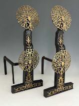 Manner of Ernest Gimson, a pair of Arts & Crafts brass and iron fire dogs, of 17th Century design,