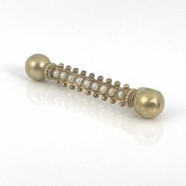 An Etruscan revival yellow metal and split pearl bar brooch, double ended baton form with