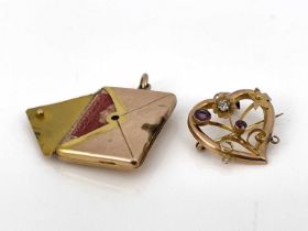 A 9 carat gold combination envelope stamp case photo locket, together with a gem set heart shaped