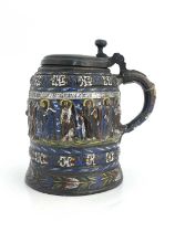 A Kreussen stoneware pewter mounted tankard, 17th century, relief moulded decoration depciting Jesus