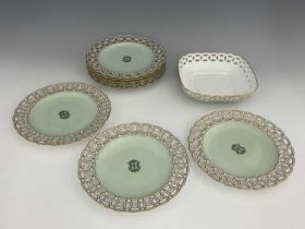 A set of eight Minton dessert plates, circa 1877, circular form decorated with a monogram to a