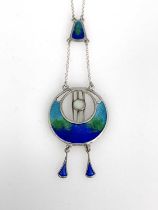Charles Horner, an Arts and Crafts silver and enamelled pendant, Chester 1918, circular Egyptian