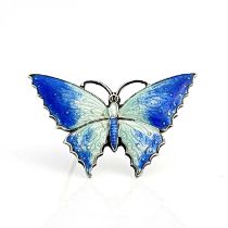 A George V silver gilt and enamelled butterfly brooch, C & H, Birmingham 1918, the wings in basse