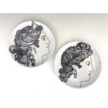 Pierro Fornasetti for Eschenbach, a pair of Le Bellezze plates, circa 1950s, decorated in black with