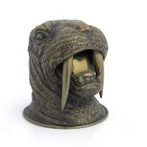 A novelty brass inkwell, circa 1880, realistically modelled as a walrus head, mouth open, 10.5cm