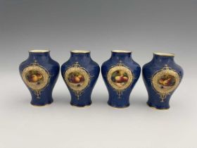A set of four Royal Worcester fruit painted vases, circa 1938, baluster form, decorated with fruit
