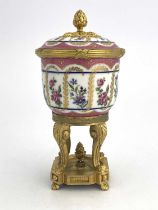 A Paris porcelain and ormolu mounted potpourri vase and cover, pink ground beaker bowl with gilt