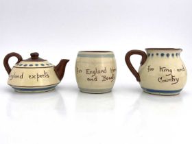 A Devon Regiment Torquay Ware three piece tea set, applied with the regimental badge to each