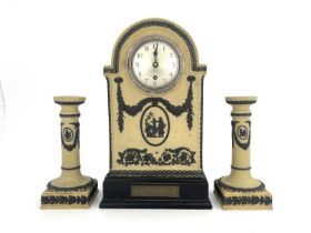 A Wedgwood tri colour Jasperware clock garniture set, yellow ground, domed bracket form with black