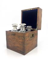 A 19th Century oak and brass bound decanter box, flush side handles, blue velvet fitted interior