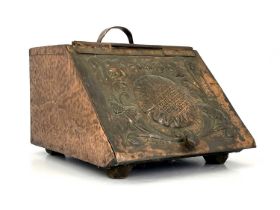 John Pearson (attributed) an Arts and Crafts copper clad coal scuttle, the hinged lid repousse