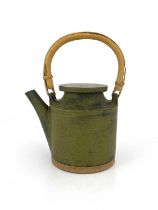 Robin Welch (British, 1936- 2019), a stoneware teapot with a cane handle, impressed maker's mark