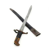 A 19th century British Lancaster sword bayonet, two piece chequered and brass grip, housed in