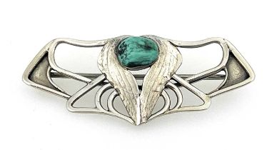 Oliver Baker for Liberty and Co., a Cymric Arts and Crafts silver and turquoise brooch, open