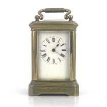 A miniature carriage timepiece, early 20th Century, brass corniche case with visible escapement,