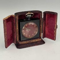 A chiming miniature desk or travel clock, circa 1910, anodised steel case with topwind mechanism,