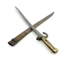 A Dutch 1873 yataghan sword bayonet, brass grip and quillon, housed in steel scabbard, ricasso