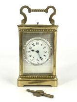 A French repeating carriage clock, early 20th Century, gilt metal corniche case with swing handle,