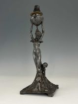 WMF, a Jugendstil silver plated figural table lamp, the square sweeping base modelled in relief with