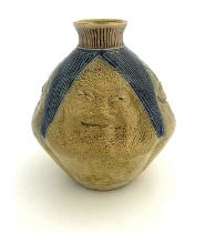 Robert Wallace Martin for Martin Brothers, a stoneware face vase, circa 1880, ovoid form, modelled