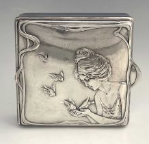 An Art Nouveau silver plated box, in the style of WMF, square section, the hinged lid cast in relief